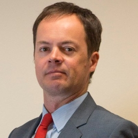 A man standing in front of a camera.